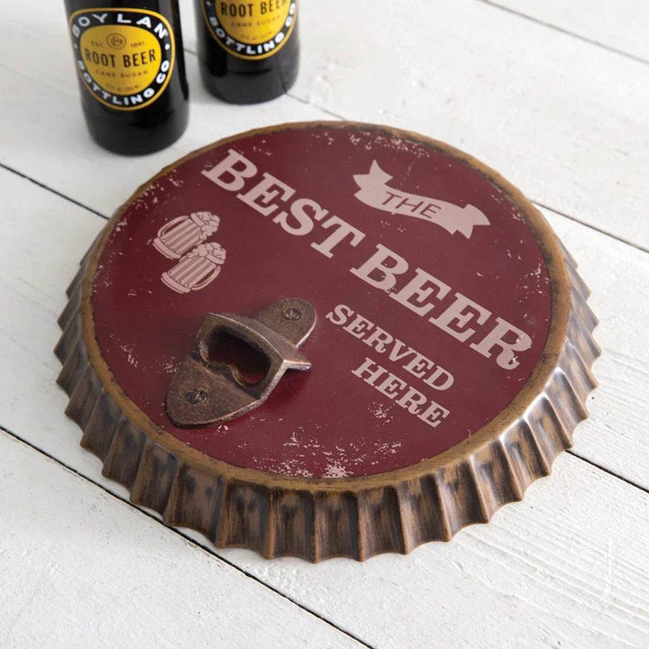 Effortlessly open beer bottles with this unique wall art piece. Featuring a bottle opener and bottle cap design, this beer sign is the perfect addition to any kitchen, man cave, or rustic themed space. Say goodbye to fumbling for a bottle opener and hello to functional and stylish wall decor.