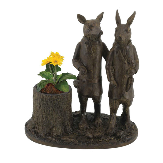 Add a touch of whimsy to your garden or living room with the Black Forest Fox and Rabbit Planter. Crafted from durable resin, this spiced walnut finished planter features charming characters of a fox and rabbit. Perfect for adding a unique touch to your garden decor.