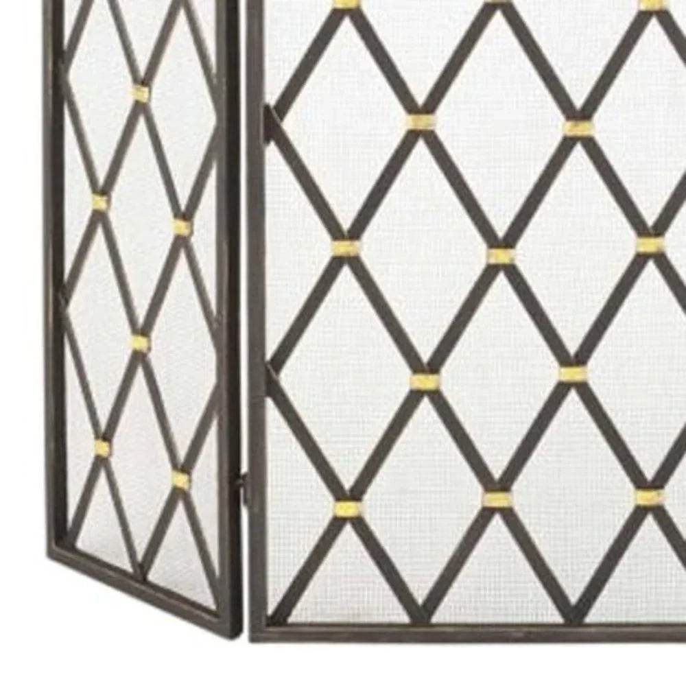 Side-angle view of geometric fireplace screen with hinged panels and golden diamond detailing on a burnished gold iron frame.