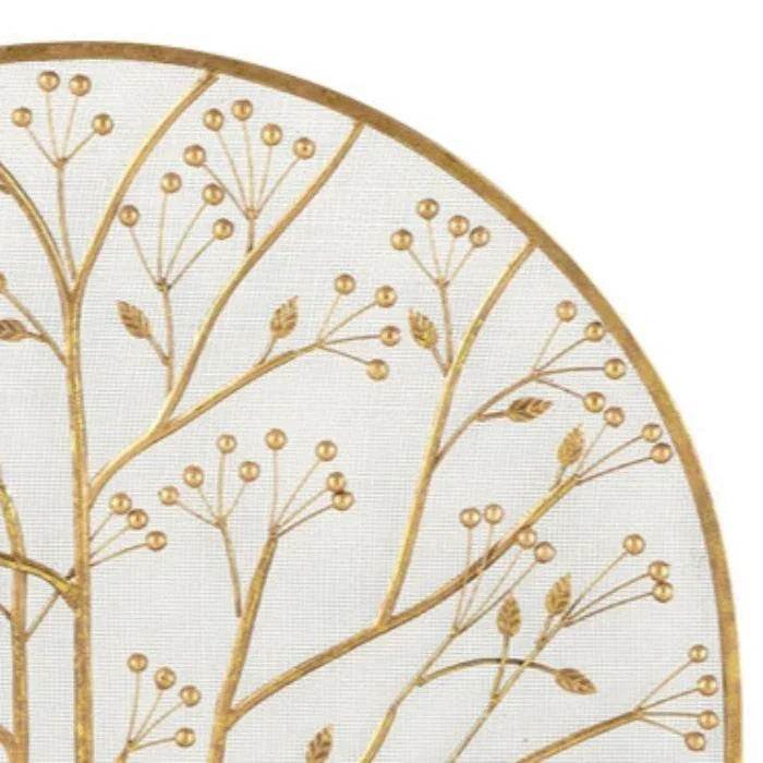 Hand-forged gold fireplace screen with curved top and botanical detailing, shown from an angled side perspective.