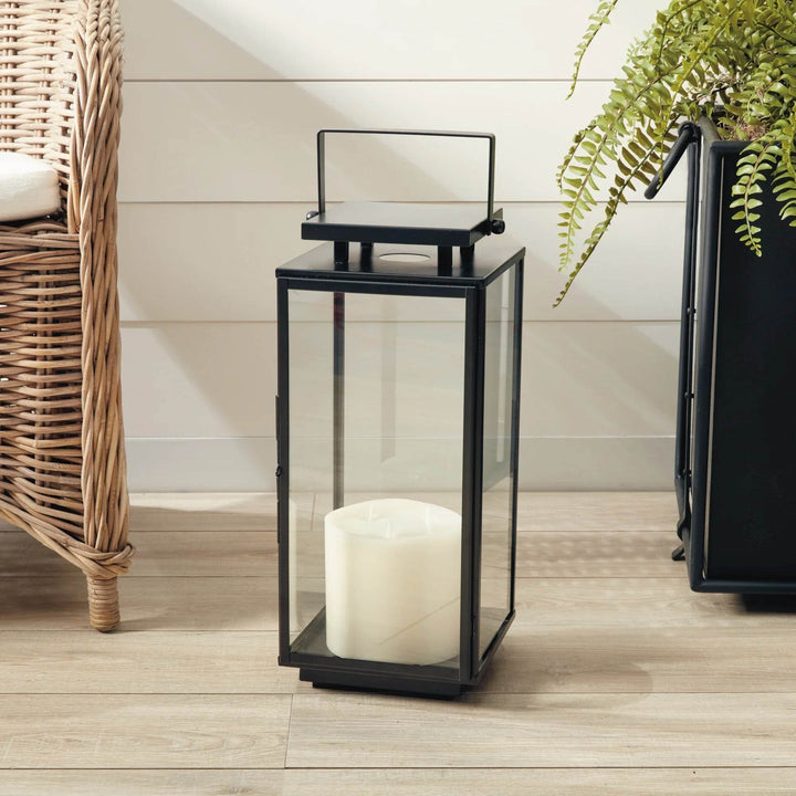 Small black stainless steel outdoor lantern with glass panels, compact 19 inch size designed for pillar candles – Transitional