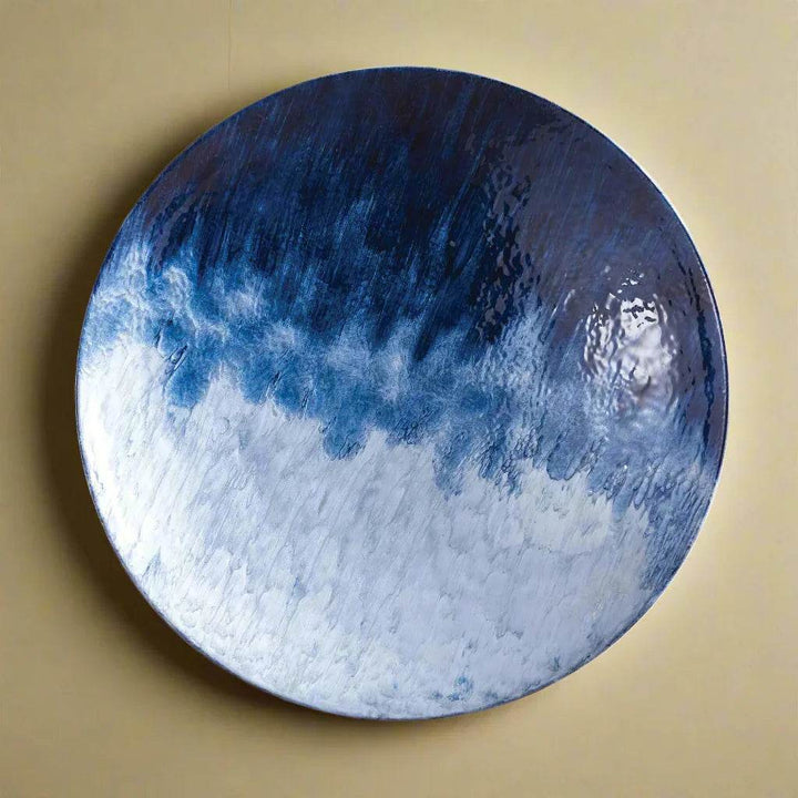 Round decorative plate in coastal blue ombre finish, wall-mounted as sculptural art