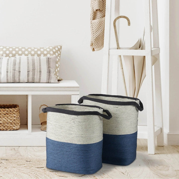 Pair of woven blue and white baskets styled in coastal bedroom beside bed – Modern Coastal.