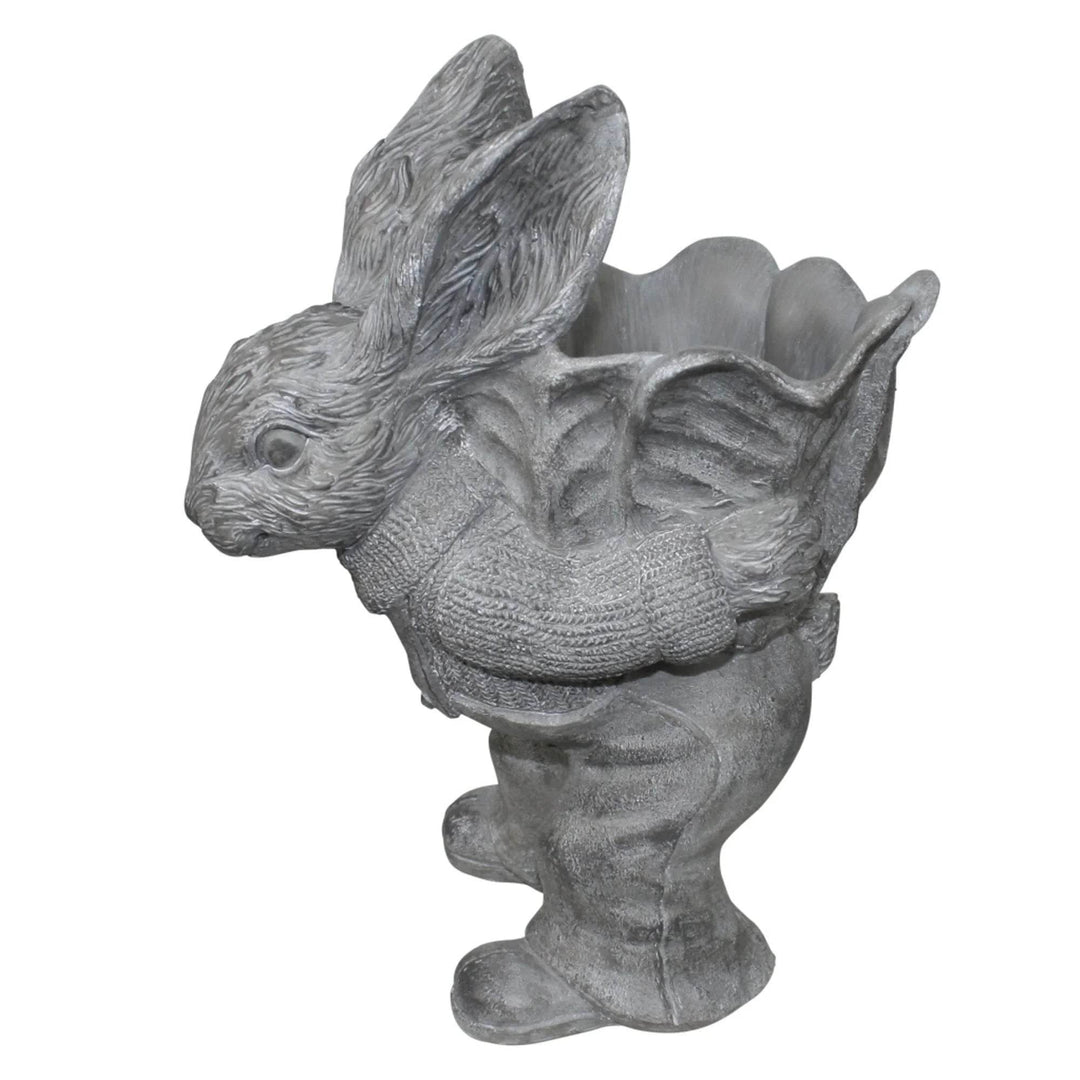 Empty cement bunny planter with sweater and backpack detail – animal-shaped garden container