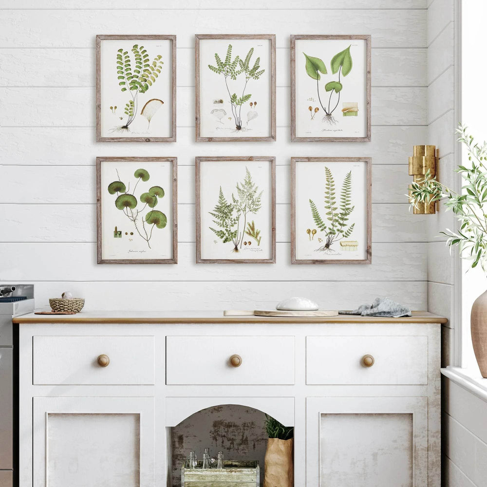 Cottagecore botanical prints displayed in white shiplap kitchen with console table