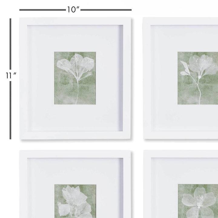 Close-up detail of white frame and green floral print showing matted border and texture