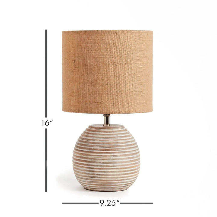 Crafted from premium mango wood and topped with a natural linen shade, the Maddie Table Lamp is perfect for small kitchens and workspaces. Its petite shape adds a touch of elegance to any room. Sleek and whitewashed, it exudes a sense of sophistication.