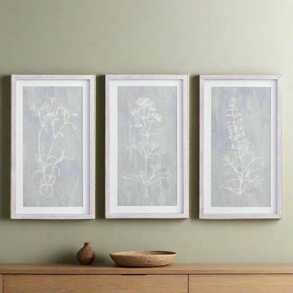 Modern farmhouse gallery wall with 3 framed botanical prints in gray and white, styled above a console