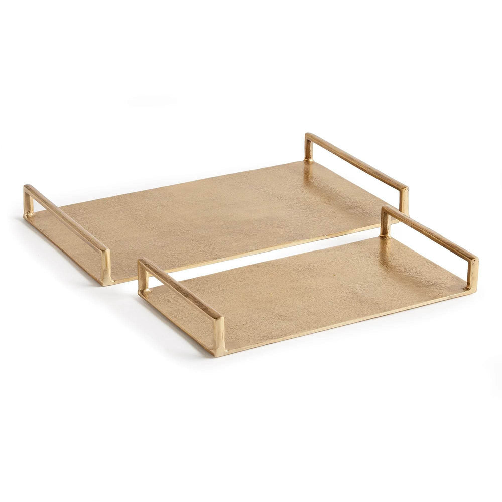 Gold textured decorative trays nested together, rectangular cast aluminum pair with open handles on white – Transitional.