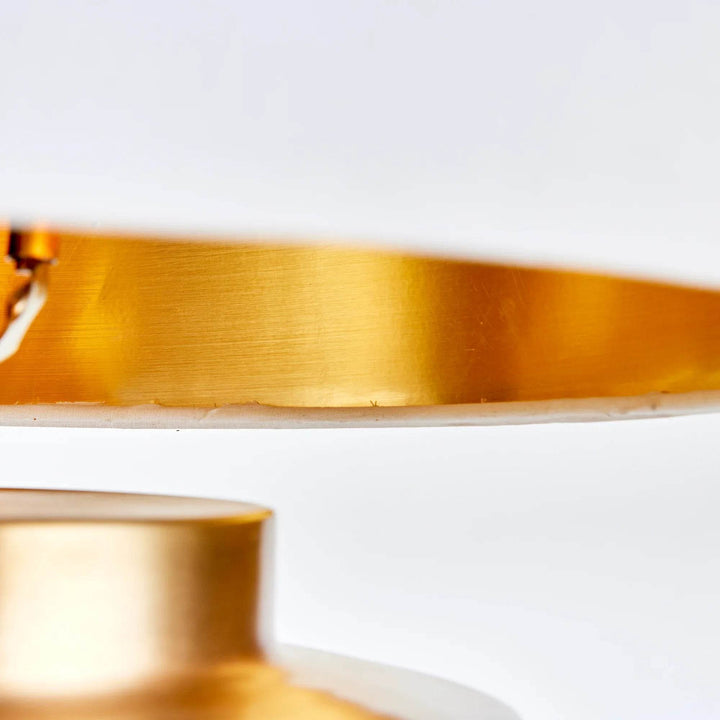 White gallery shade with gold inner lining for soft, reflective lighting effect