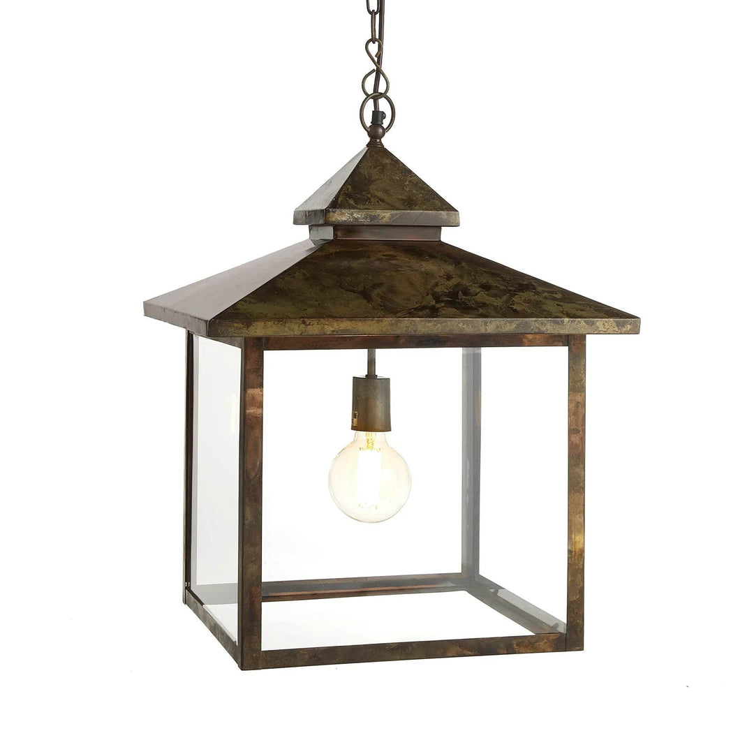 Hanging outdoor lantern with glass panels and aged iron finish in Heritage Rustic style, shown front-facing.