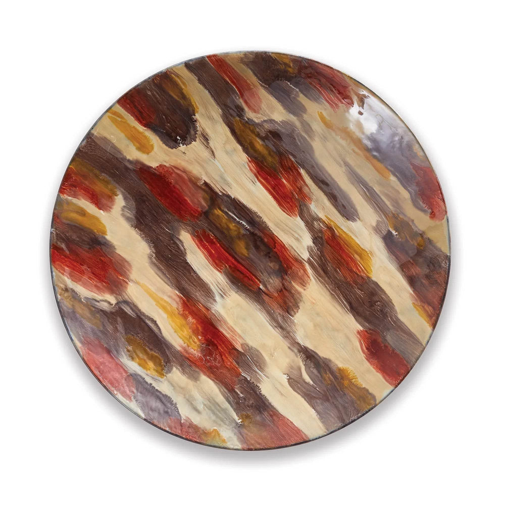 Large round enameled iron wall plate with autumn-inspired colors displayed on wall, ideal as seasonal decorative accent – Fall Decor.