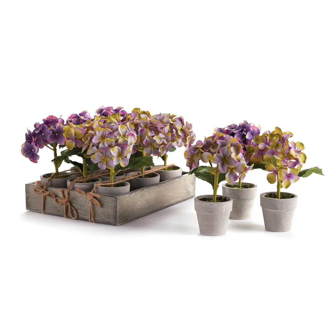 Set of twelve mini faux hydrangea potted plants in assorted purple and green tones, arranged inside a rustic wood tray – Cottagecore Classic.