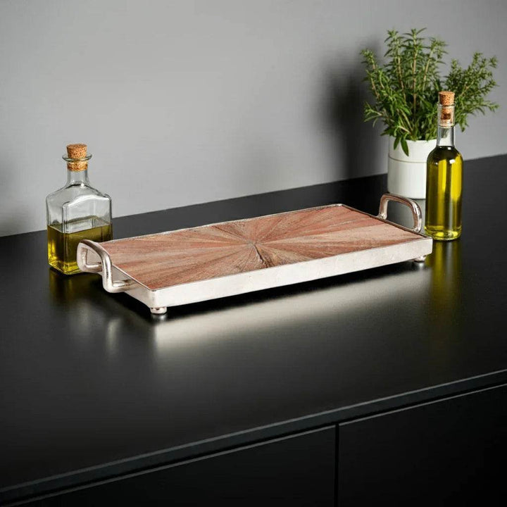Large wood and metal tray styled on dark counter with potted herbs and oil bottles, highlighting mixed material contrast – Modern Rustic