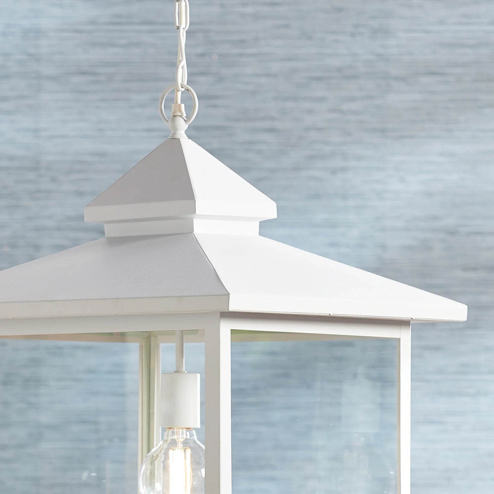 Close-up of matte white pendant light top and loop, showing refined farmhouse construction.