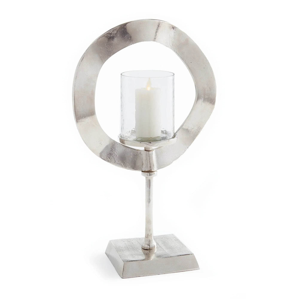 Silver candle stand with glass hurricane shown on white background, modern sculptural metal candle holder for home styling – Minimalist Glam.