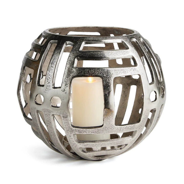 Large silver cut-out hurricane candle holder in modern industrial style, cast aluminum decor for indoor use with LED candles.