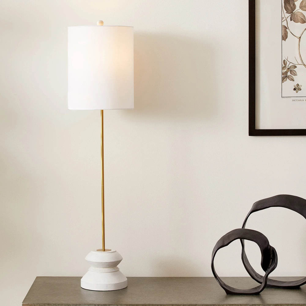 Tall whitewashed table lamp on console with sculptural decor, modern rustic entryway styling