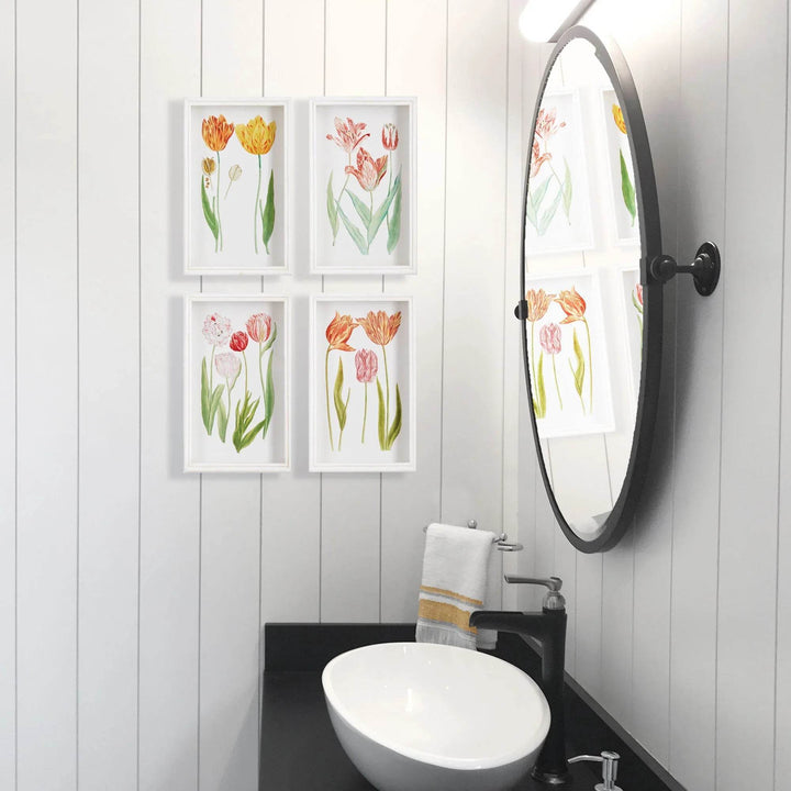 Tulip wall art set arranged in a white-paneled bathroom beside a round mirror and black faucet – Cottage Garden