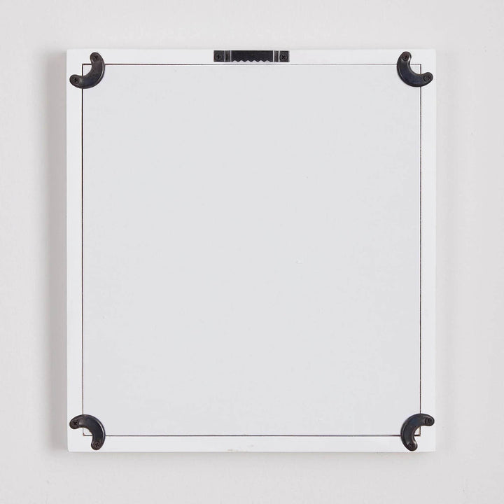 Rear view of framed floral print showing secure hanging hardware and protective corners