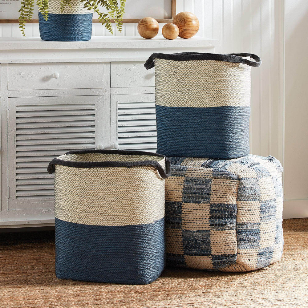 Blue and white woven storage baskets styled with coastal decor in living room – Modern Coastal.