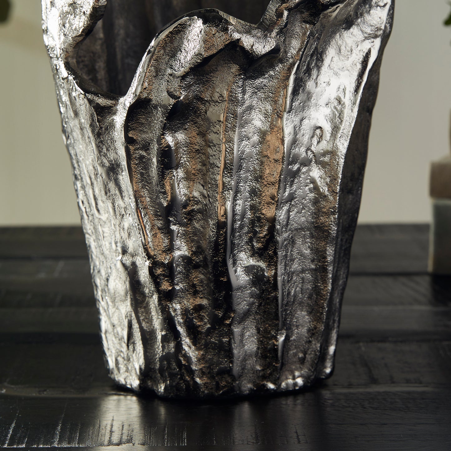 Made of a substantial cast aluminum, our Arbre Vase is an organic, sculptural piece. Add an orchid or display as is. Either way, a true original. Crafted from high-quality cast aluminum, the Arbre Silver Vase Small is an incredible example of nature-inspired art. Its beautifully organic design makes it the perfect display for your favorite orchids or as a standalone piece in any room. Experience the timeless elegance of this exquisite vase and add a touch of originality to your décor.