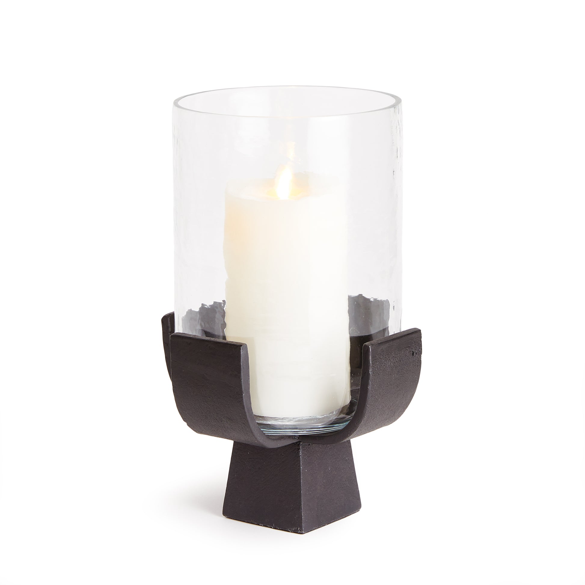 A sturdy bronze modern form cradles a glass cylinder of hammered glass. As sculptural as it is functional. Just add a candle for a warm glow.