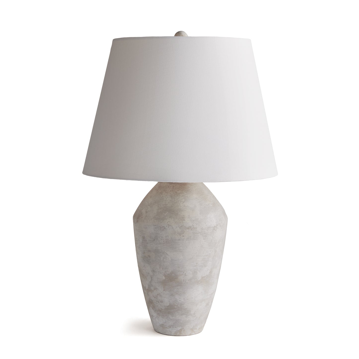 This handsome lamp has a classic silhouette. The body was crated from a centuries old wooden mold. We brought it back to life in this warm stone finish. Topped with a tapered fabric shade, it makes a dynamic, storied lamp for family room, study or bedroom.