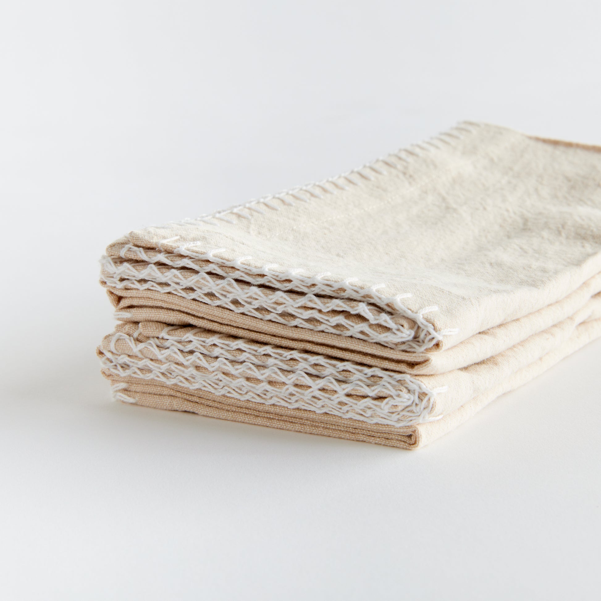 Experience the ultimate softness with this set of four cotton napkins. Made with premium quality cotton, these napkins boast a beautiful tone and texture, perfect for any tablescape. The neutral taupe color allows them to effortlessly complement and elevate your dining experience. Add a touch of elegance to your tabletop collection with these versatile and high-quality napkins.