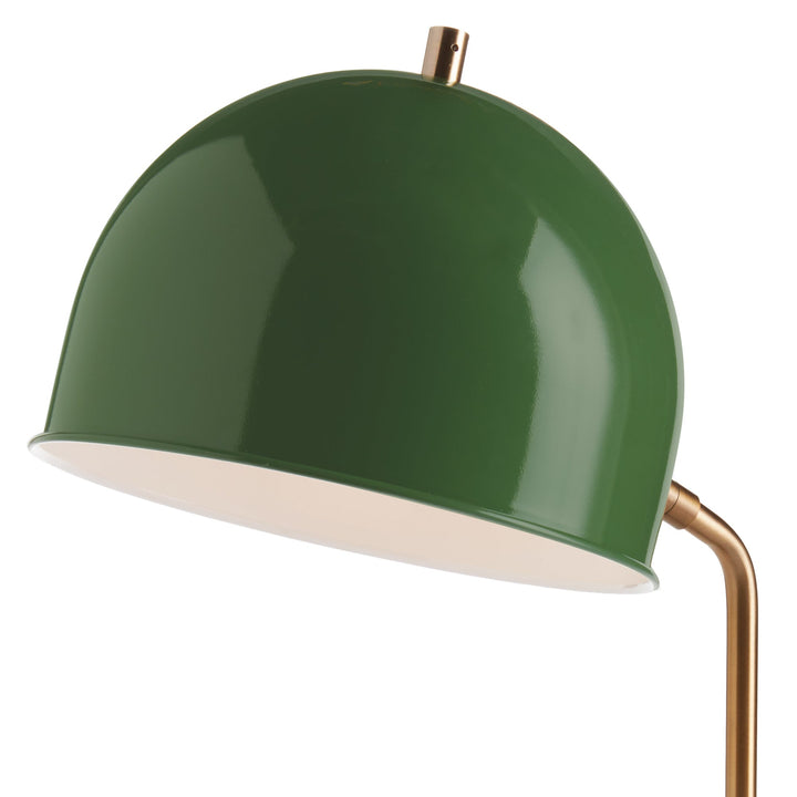 Constructed with a striking combination of a luxurious emerald green metal lamp shade and a sleek, contemporary base, this desk lamp is sure to make a statement in any home or office