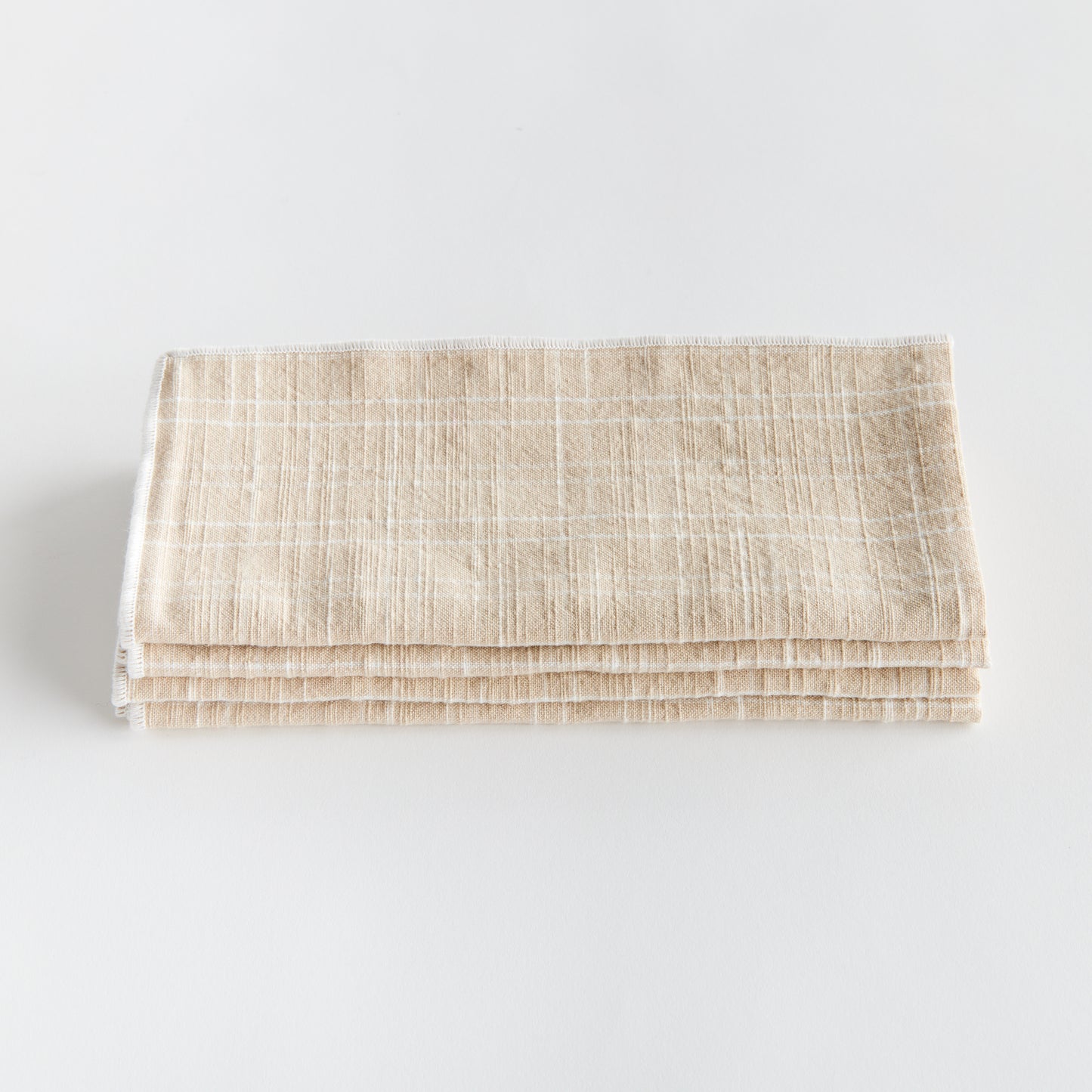 Bring a touch of softness to the table with this set of four cotton napkins. Beautiful in tone and texture, the soft taupe is made to coordinate with any tablescape. Elevate your dining experience with these high-quality cotton napkins. Their luxurious texture and neutral taupe color will elevate any tablescape, making it perfect for any occasion.