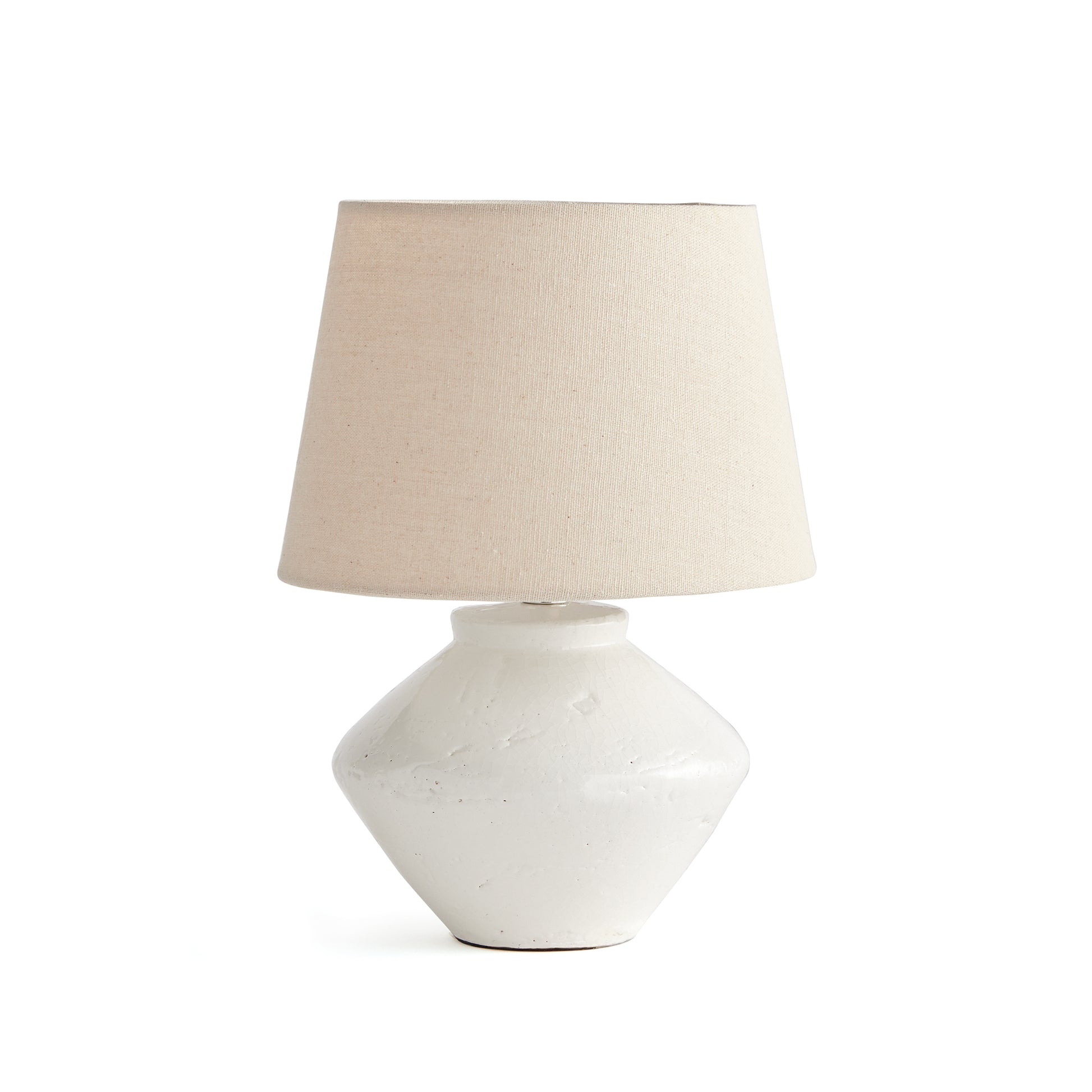 This sleek ceramic mini lamp is at home in any transitional setting. The textured cream shade and petite Base make it a versatile piece. Great for kitchen counter, bookshelf or desk.