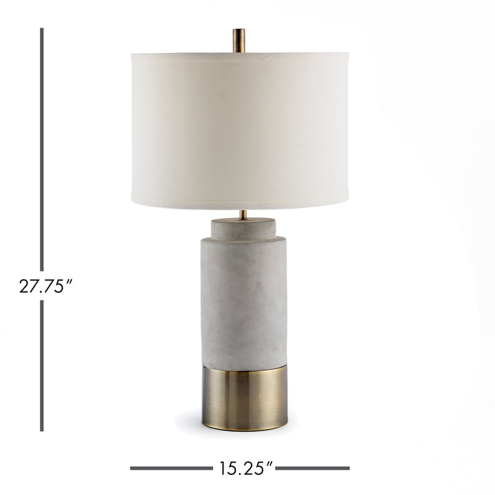 The sleek, slender base and refined shade are expertly crafted, highlighting the lamp's quality materials of ceramic, metal, and antique brass. With a sturdy concrete-like finish, this lamp is guaranteed to add a touch of elegance to any room.