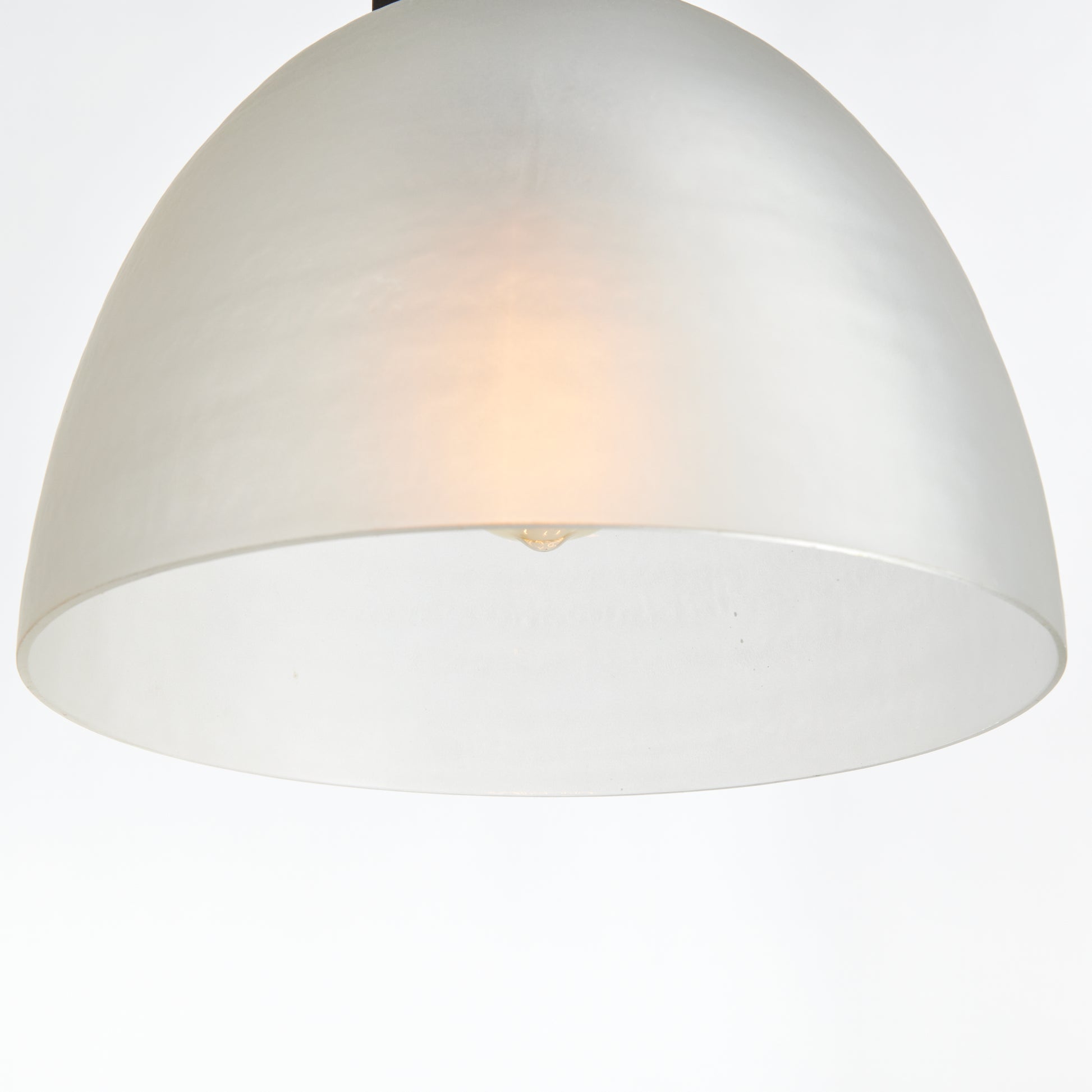 This antique bronze pendant light boasts a timeless design, with its warm finish and opaque matte glass providing a diffused light. Ideal for adding a touch of classic elegance, it can be hung over an island, in an entryway or foyer.