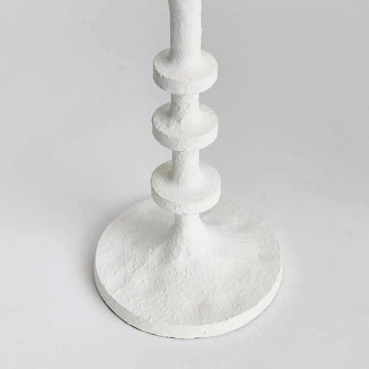 These candle stands feature notches along the body, reminiscent of the traditional method of counting, adding a playful touch. They are designed to hold up to 4" diameter pillars and are ideal for display on a mantle or at the front entry. Not only do they add a charming reference to traditional counting, but they also bring a modern element to the space. With a capacity of up to 4" diameter pillars, this set of two stands is a practical and stylish addition to any mantle or front entryway.