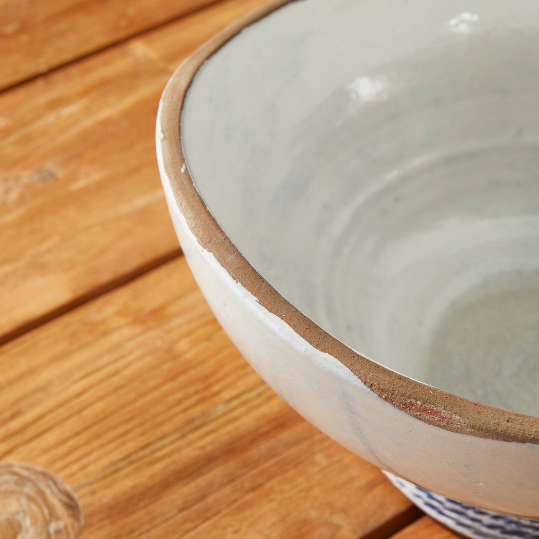 Our Coastal Themed Decorative Bowl features a Grecian blue striped design and exposed clay rim, evoking the beauty of the Mediterranean. The fully glazed interior adds a touch of luxury and elegance, making it a perfect addition to any coastal-themed decor. Whether used as a stunning centerpiece or to display fresh limes, this versatile bowl is sure to impress.