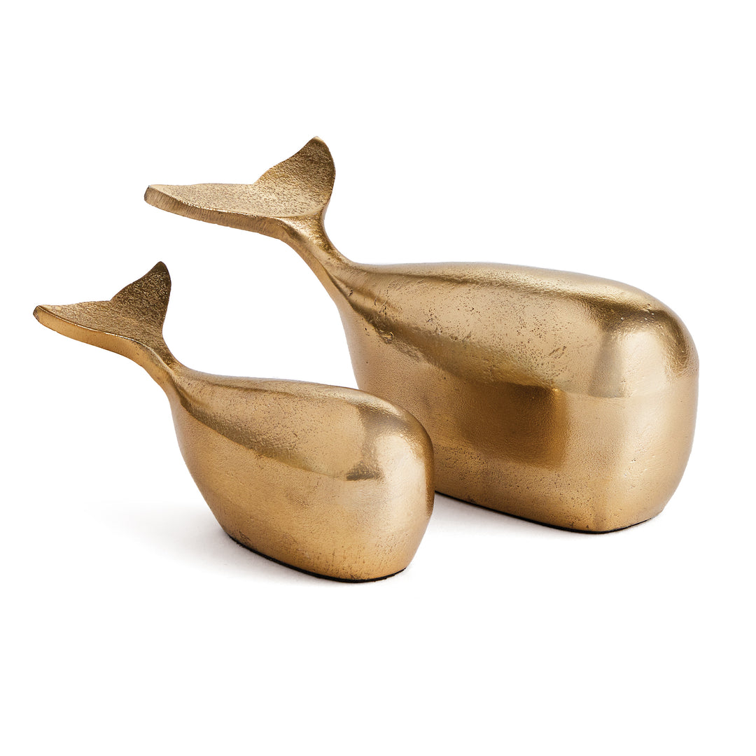 Add a touch of elegance to your coastal-inspired space with this sleek and modern set of Gold Whale Sculptures. Made from durable aluminum, these sculptures are a beautiful and charming accent for any shelf or surface. Whether for an art enthusiast or home decorator, these solid sculptures are sure to impress with their stunning design and construction.