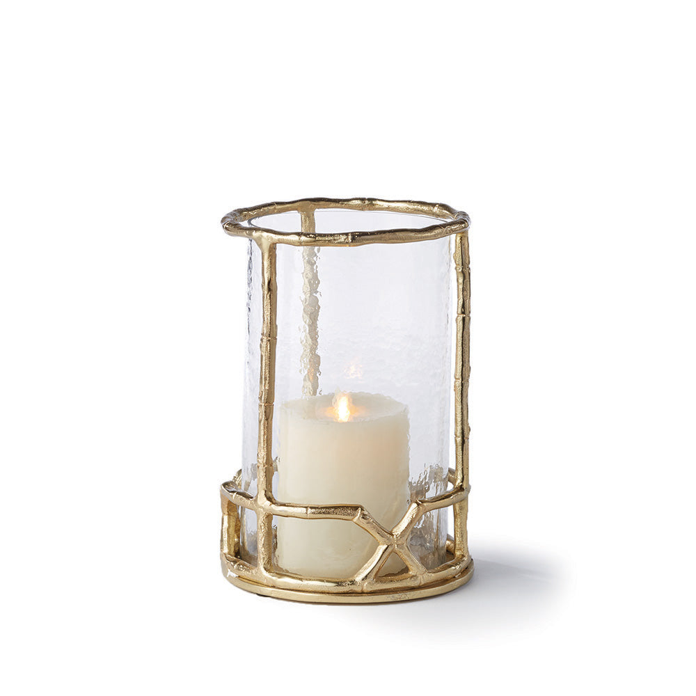 The Gold Hurricane Candle Holder 10.5" boasts a sophisticated design, featuring a gold bamboo-like structure and seeded glass insert. Made with expert craftsmanship, this candle holder adds a touch of elegance to any room. For a cohesive and stylish look, consider the available size of 16".