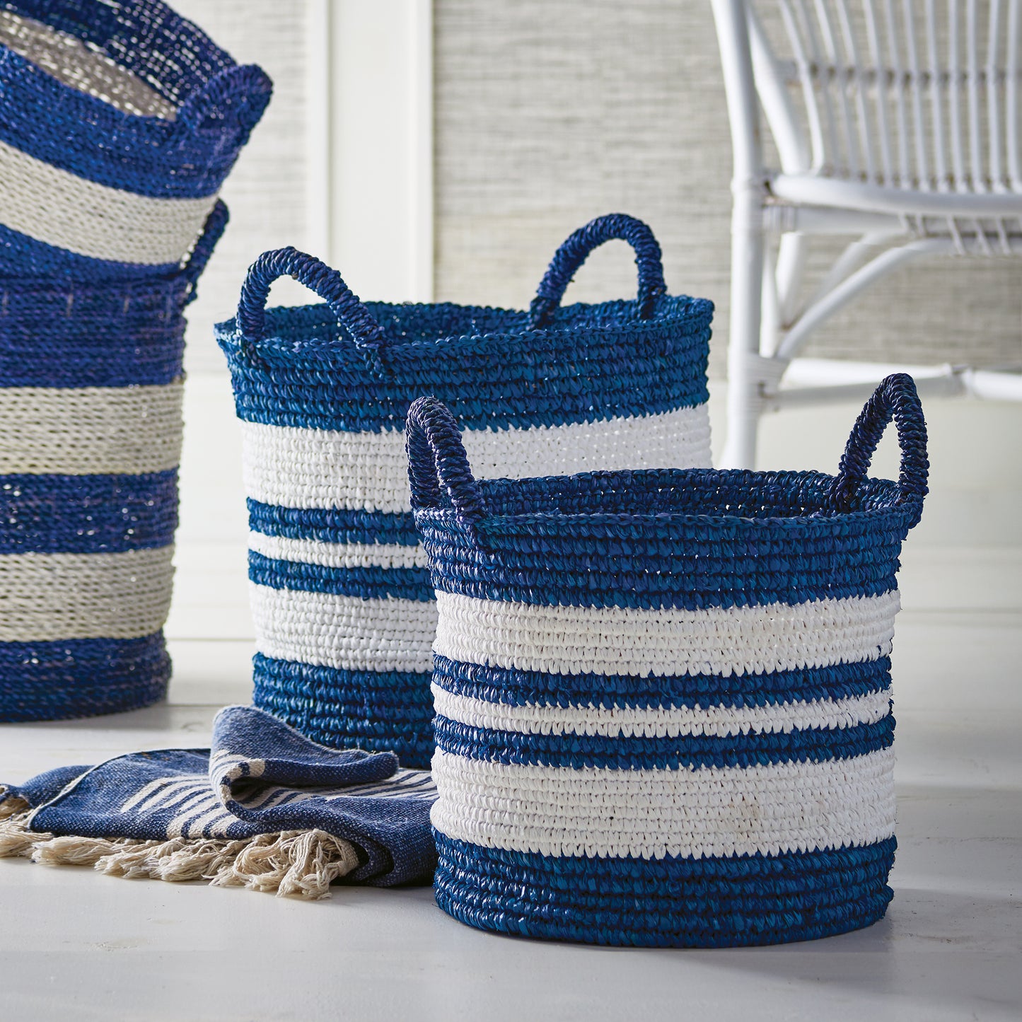 Imbued with the timeless grace of Barclay Butera's signature blue and white, these striped baskets offer both form and function. Skillfully crafted and expertly embellished, they make a chic addition to any space, whether in your laundry room, or as stylish storage for linens and towels.