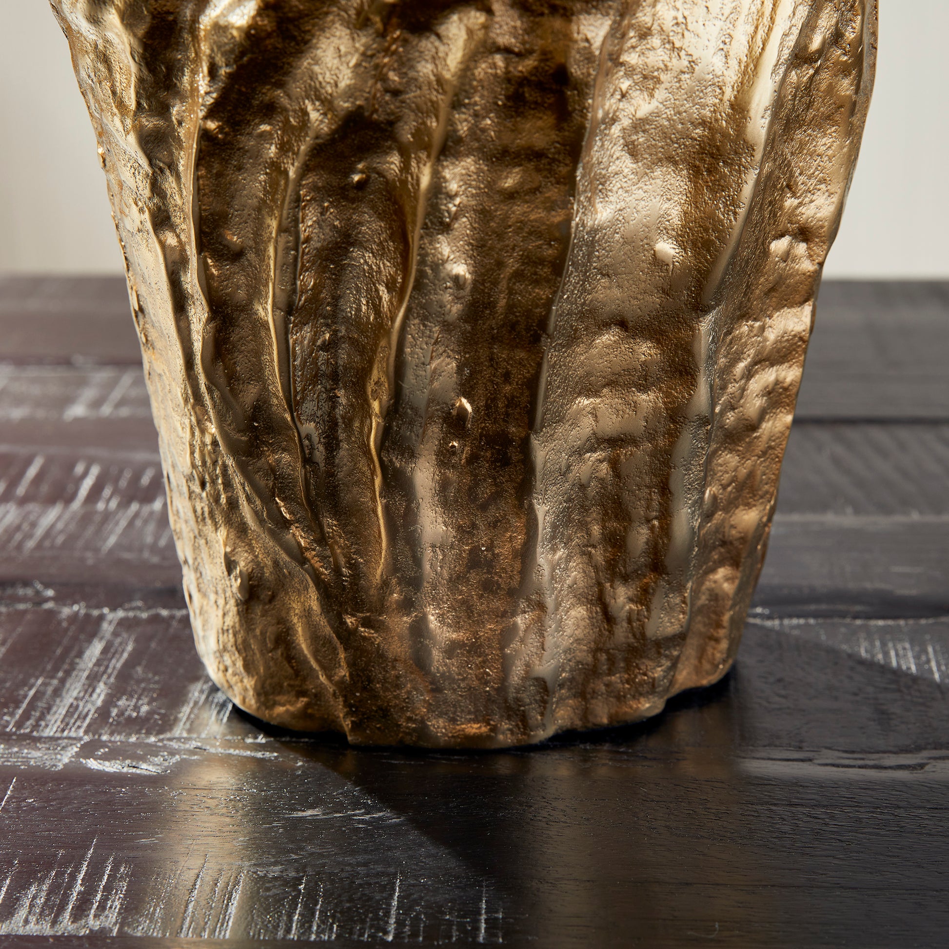 Crafted from durable cast aluminum, our Arbre Gold Vase Large is a beautiful and unique piece of artwork. Its organic, sculptural design makes it a perfect choice for displaying orchids or as a standalone statement in any room. With its intricate details and high-quality material, this vase is sure to elevate the look of any space.