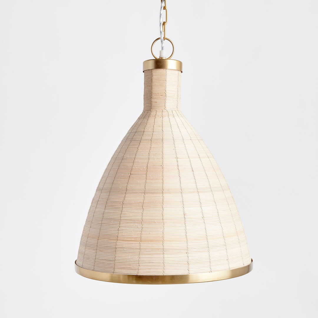 Experience the timeless style of the Maye Petite Bell Pendant Light in white, featuring a natural cane rattan weave with unique variations in color. The brass details on the top and bottom rim add a refined touch to this classic piece. Whether hung in a kitchen, entryway, or hallway, this pendant light will elevate any space with its sophisticated charm.