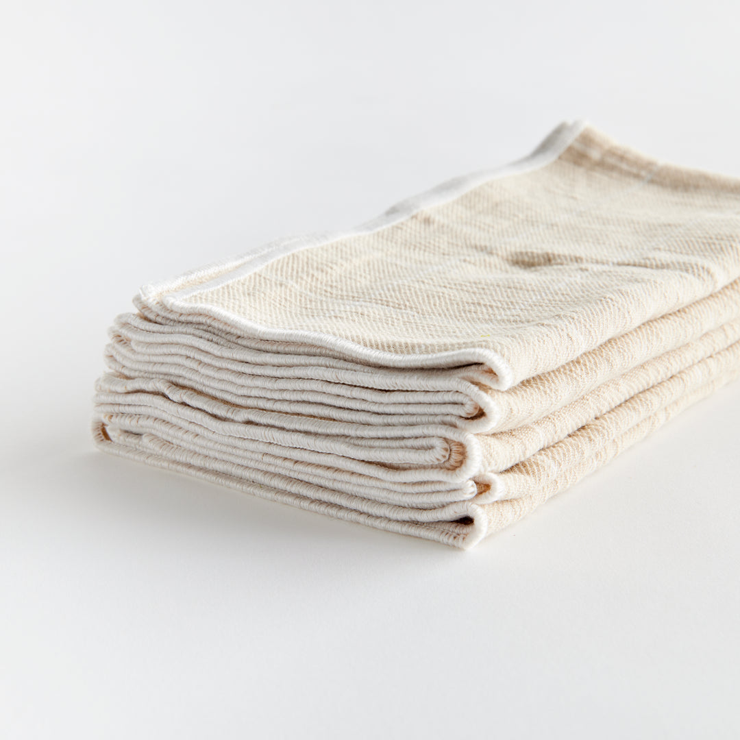 These four cotton napkins add a touch of softness to your table. The beautiful and textured soft taupe is designed to match any tablescape. Made of 100% cotton, they offer a luxurious and high-quality dining experience. The neutral taupe color seamlessly complements any table setting, enhancing both style and functionality for your meals.