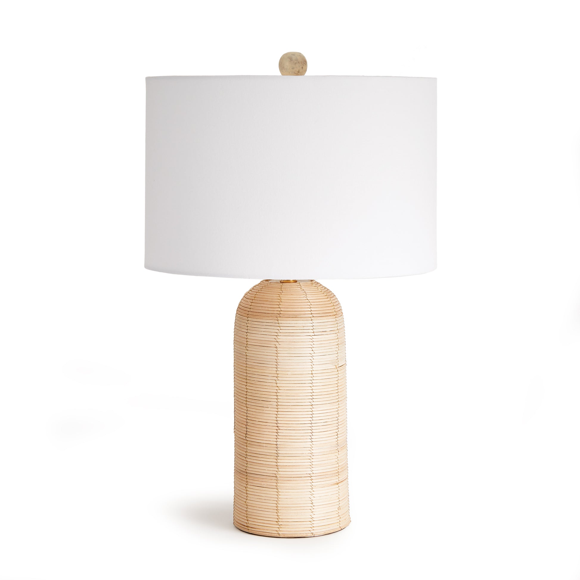 Woven in a whitewash cane rattan, with subtle variations in color that makes each one truly unique, this lamp is an instant classic. Topped with a wide cylindrical shade, a perfect accent for bedroom, living room or study.