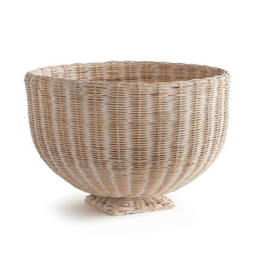 Double-walled and scaled to impress, this 24 inch rattan woven footed bowl is a stunner. With beautiful varying natural tones in the rattan and reinforced by an iron framework, it is made to keep its original shape. An exclusive design you won't see anywhere else. Makes a beautiful table centerpiece, or sit atop a column for an unforgettable entryway.