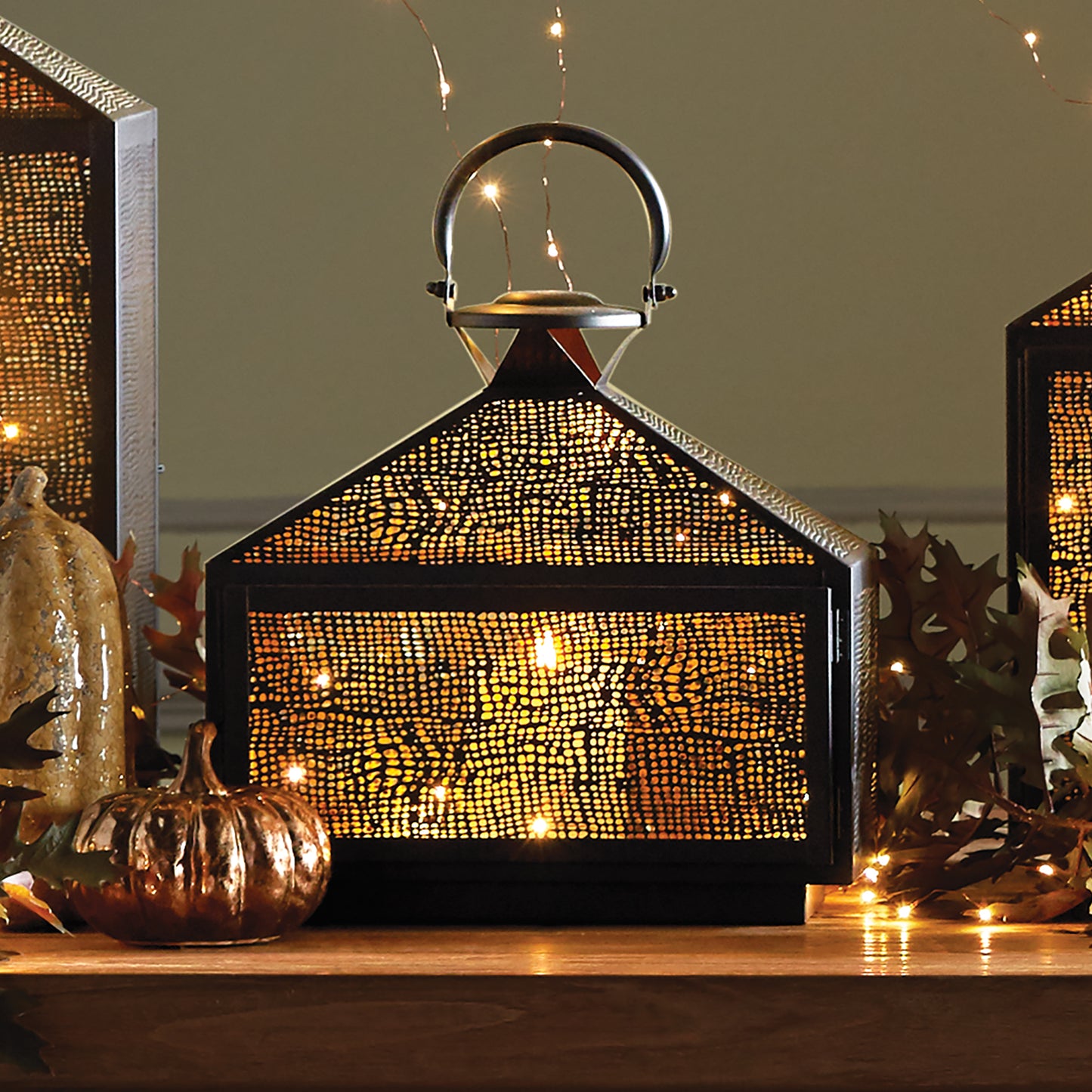 With its intricate mesh design and golden brass interior, the Amhurst creates a stunning effect by gently diffusing candlelight and enhancing its warm glow. This lantern adds a touch of elegance and warmth to any room, making it the perfect choice for any space.