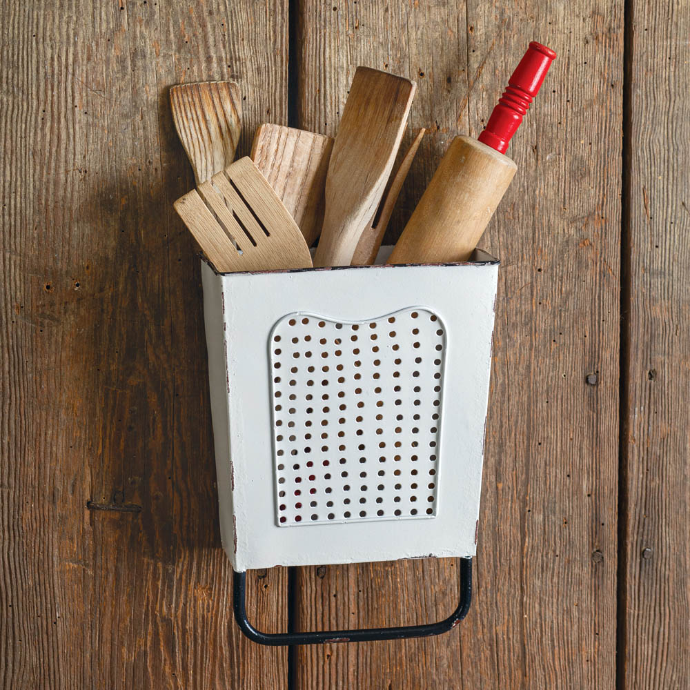 Organize your kitchen with our Rustic Wall Mount Utensil Holder in White. Its sturdy mesh front and metal construction provide a touch of rustic charm while keeping your utensils within reach. Save valuable counter space and add a stylish touch to your kitchen decor. Utensils not included.