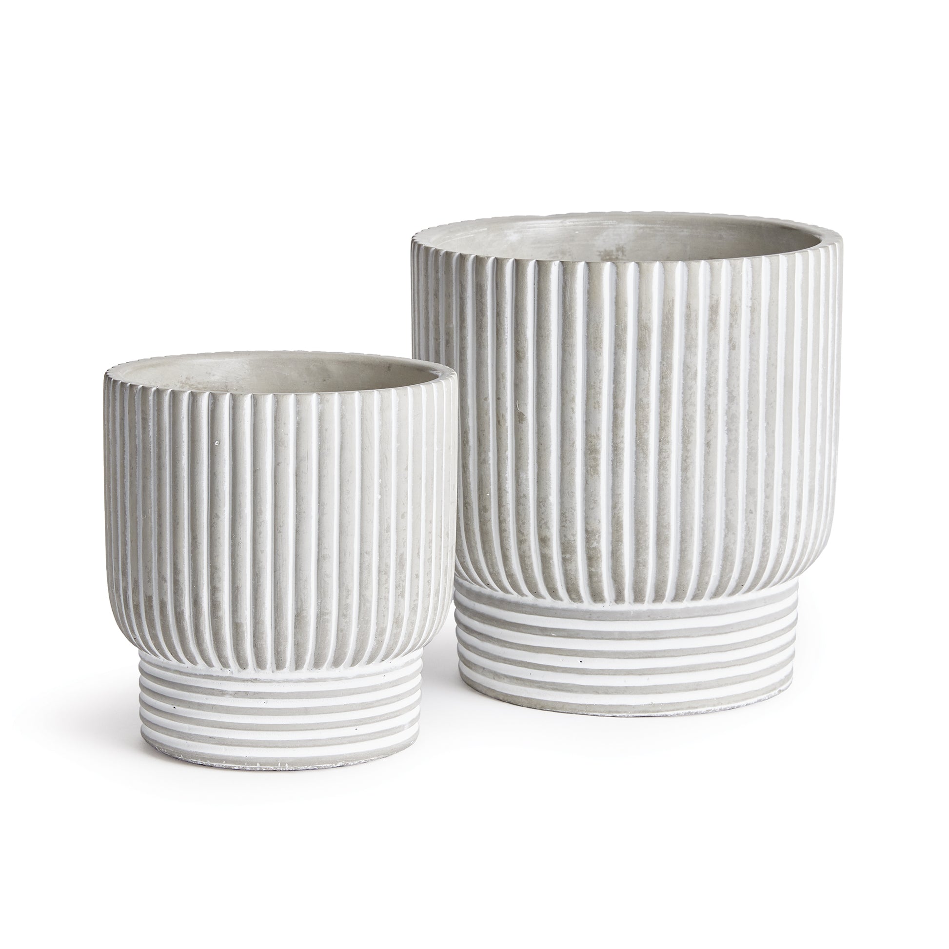 A mixed pattern of horizontal and vertical lines make this set of pots very mod indeed. A translucent white wash artfully fills in the gaps. Add your favorite blooms or lush greens and enhance any contemporary space.