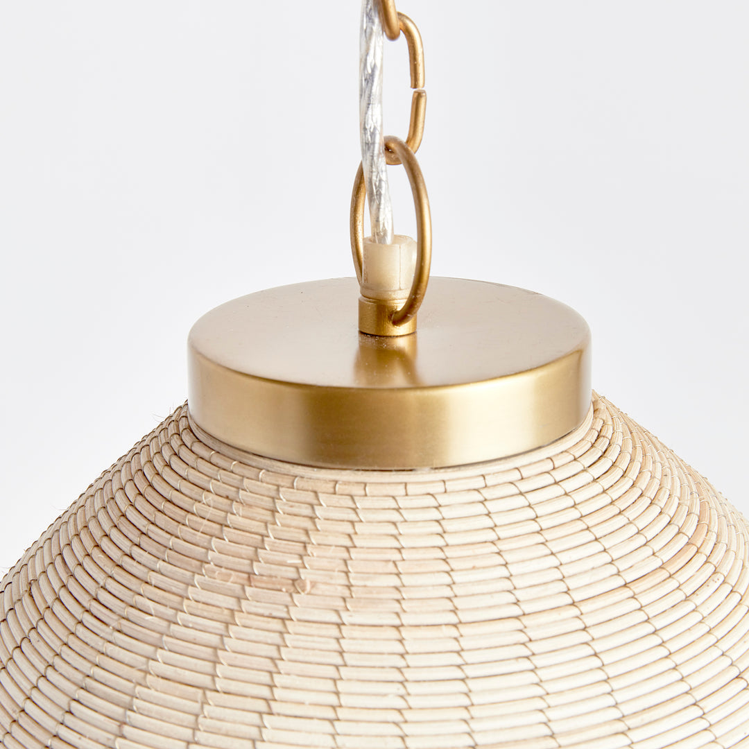 Woven in a natural cane rattan, with subtle variations in color making each one truly unique, this pendant is an instant classic. The brass details on the top and along the bottom rim make it decidedly more refined. And talk about scale! A show-stopping choice for kitchen island, entry foyer or hallway.