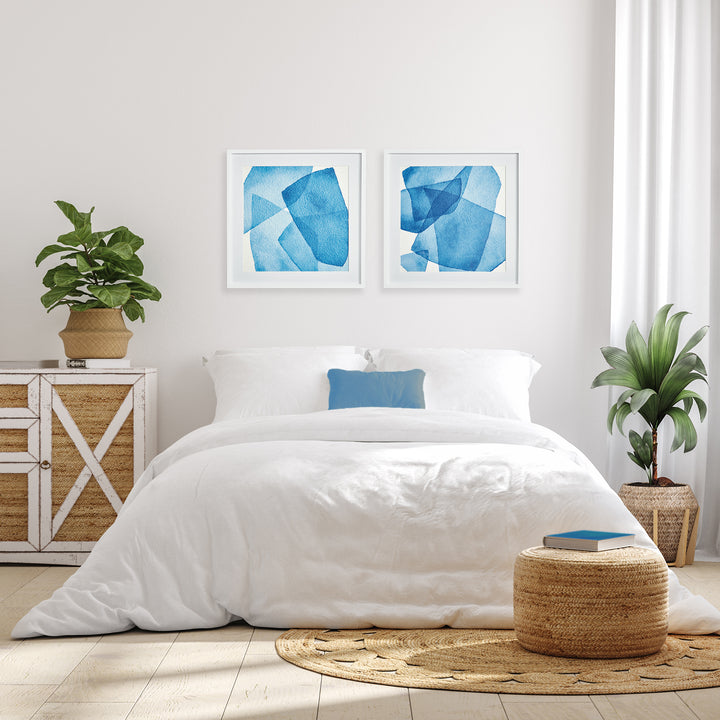 Utilize the stunning layers of abstract blue hues and simple white frame to capture the tranquil essence of the ocean and sky in our Abstract Watercolor Wall Prints Set. This pair of prints perfectly complements the modern coastal atmosphere, adding a touch of sophistication to any space. Choose to elevate your home with our expertly crafted prints.