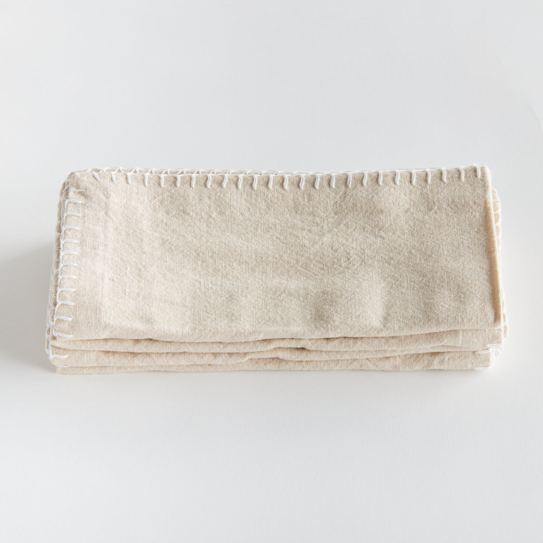 Experience the ultimate softness with this set of four cotton napkins. Made with premium quality cotton, these napkins boast a beautiful tone and texture, perfect for any tablescape. The neutral taupe color allows them to effortlessly complement and elevate your dining experience. Add a touch of elegance to your tabletop collection with these versatile and high-quality napkins.